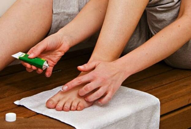 Apply antifungal ointment to feet to treat ringworm